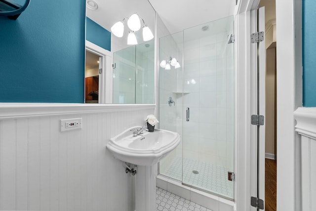 2031 W Saint Paul Ave Unit 2W, Chicago, IL 60647 - full bathroom featuring a stall shower and a wainscoted wall