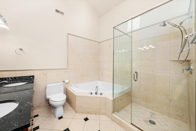 2031 W Saint Paul Ave Unit 2W, Chicago, IL 60647 - full bathroom with a stall shower, double vanity, tile walls, a garden tub, and tile patterned floors