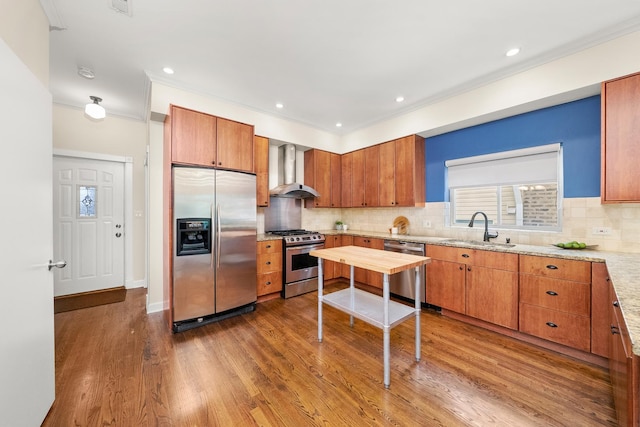 2031 W Saint Paul Ave Unit 2W, Chicago, IL 60647 - kitchen with stainless steel appliances, wall chimney exhaust hood, ornamental molding, wood finished floors, and decorative backsplash
