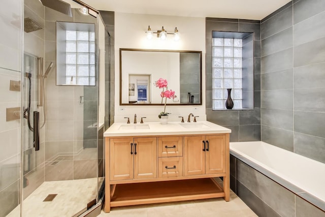 2145 W Crystal St Unit 1, Chicago, IL 60622 - bathroom with a stall shower, double vanity, a garden tub, and tile patterned flooring