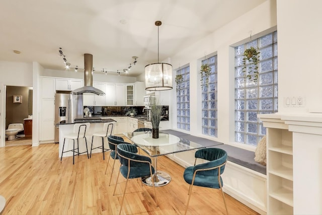 2145 W Crystal St Unit 1, Chicago, IL 60622 - dining room featuring light wood-style flooring and track lighting