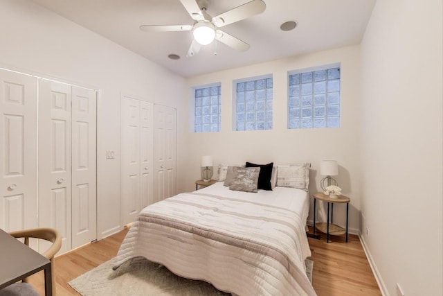 2145 W Crystal St Unit 1, Chicago, IL 60622 - bedroom with two closets, light wood-style flooring, and ceiling fan