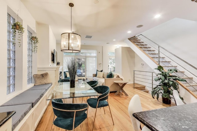 2145 W Crystal St Unit 1, Chicago, IL 60622 - dining room with light wood finished floors, stairway, recessed lighting, and a chandelier