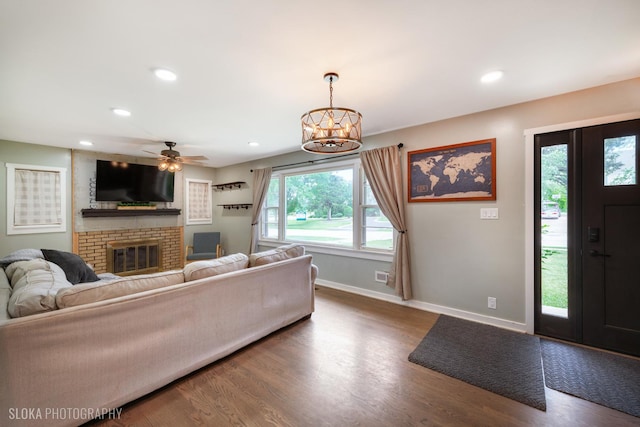 531 Rockland Rd, Crystal Lake, IL 60014 - living room with wood finished floors, a fireplace, a chandelier, a ceiling fan, and recessed lighting