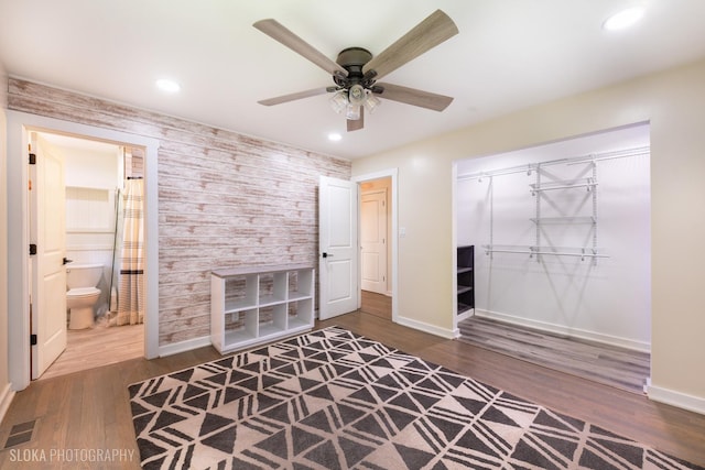 531 Rockland Rd, Crystal Lake, IL 60014 - bedroom with wood finished floors, recessed lighting, a closet, an accent wall, and ceiling fan