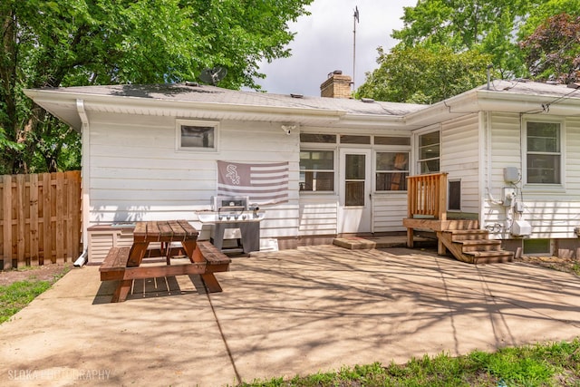 531 Rockland Rd, Crystal Lake, IL 60014 - back of property featuring a chimney, a patio area, and a sunroom