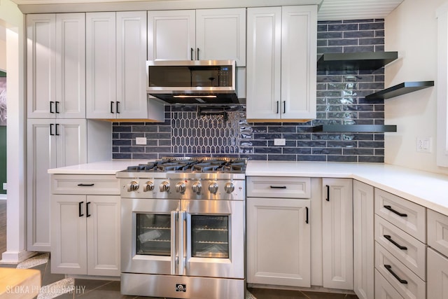 531 Rockland Rd, Crystal Lake, IL 60014 - kitchen featuring stainless steel appliances, open shelves, and tasteful backsplash