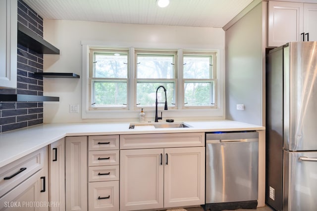 531 Rockland Rd, Crystal Lake, IL 60014 - kitchen featuring appliances with stainless steel finishes, open shelves, healthy amount of natural light, light countertops, and wood ceiling