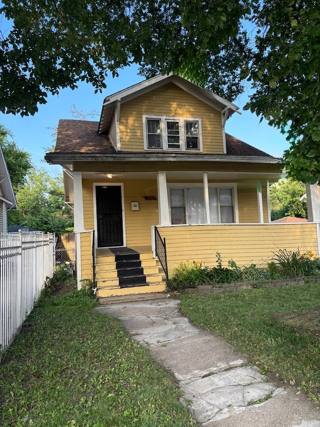15121 Vine Ave, Harvey, IL 60426 - bungalow with covered porch and roof with shingles