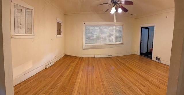 15121 Vine Ave, Harvey, IL 60426 - unfurnished room featuring crown molding, wood finished floors, a ceiling fan, and a baseboard heating unit