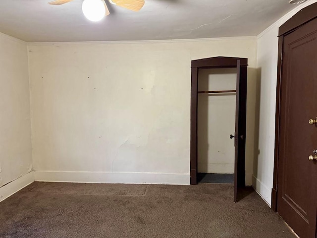 15121 Vine Ave, Harvey, IL 60426 - unfurnished bedroom with dark carpet, a closet, and crown molding