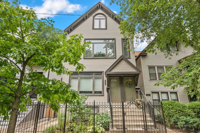3316 N Leavitt St Unit 2, Chicago, IL 60618 - view of front of home with a fenced front yard