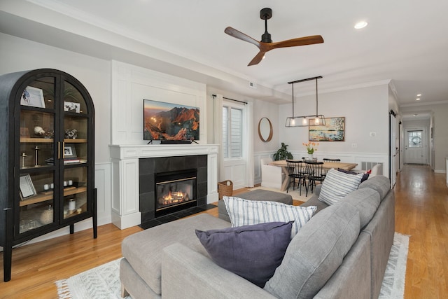 3316 N Leavitt St Unit 2, Chicago, IL 60618 - living area with crown molding, a fireplace, light wood finished floors, ceiling fan, and recessed lighting
