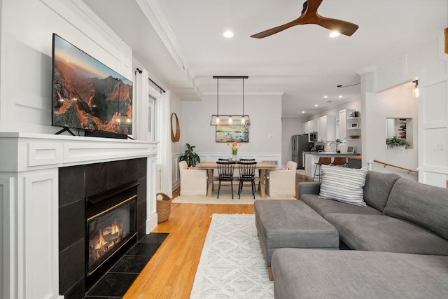 3316 N Leavitt St Unit 2, Chicago, IL 60618 - living area with crown molding, a fireplace, light wood-style floors, ceiling fan, and recessed lighting