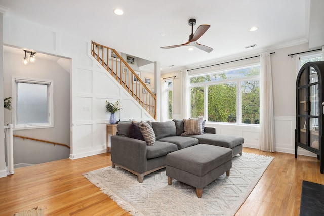 3316 N Leavitt St Unit 2, Chicago, IL 60618 - living area featuring a decorative wall, healthy amount of natural light, a ceiling fan, light wood-style floors, and stairway