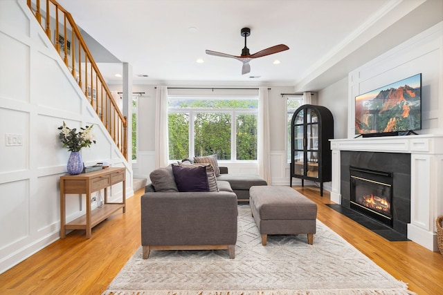 3316 N Leavitt St Unit 2, Chicago, IL 60618 - living area with a decorative wall, ceiling fan, stairs, light wood-style floors, and a fireplace with flush hearth
