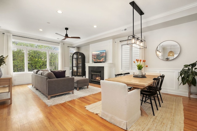 3316 N Leavitt St Unit 2, Chicago, IL 60618 - dining area with ornamental molding, a fireplace with flush hearth, light wood-style flooring, ceiling fan, and recessed lighting