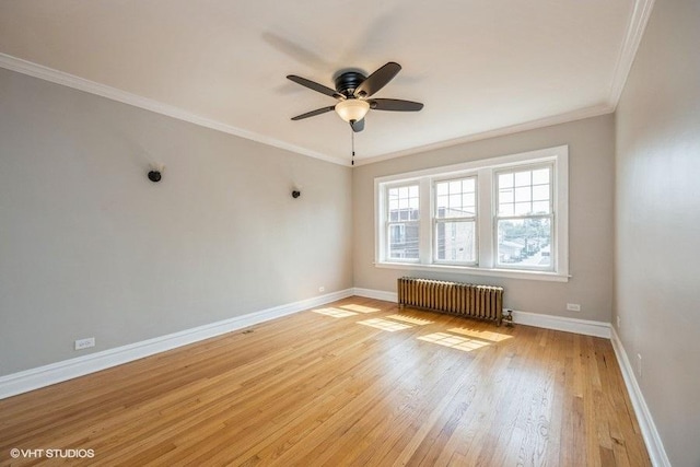 6441 W 18th St Unit 2, Berwyn, IL 60402 - empty room with radiator heating unit, light wood finished floors, a ceiling fan, and ornamental molding