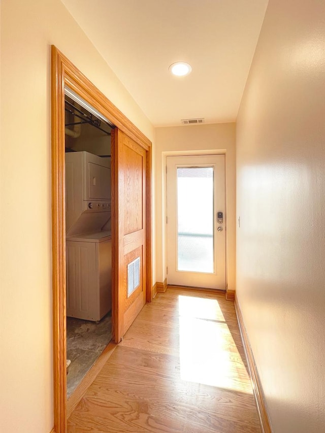 5064 W Agatite Ave Unit 3, Chicago, IL 60630 - corridor with stacked washer / drying machine, light wood-type flooring, and recessed lighting