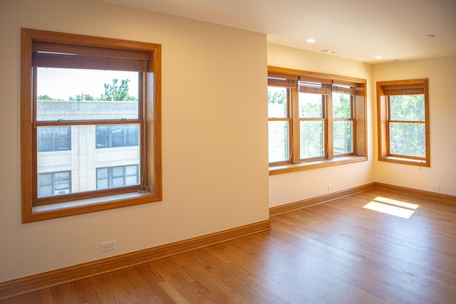 5064 W Agatite Ave Unit 3, Chicago, IL 60630 - empty room with wood finished floors and recessed lighting