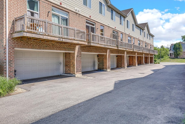 406 Prairie Ct, Morton Grove, IL 60053 - view of building exterior featuring a garage, a residential view, and driveway