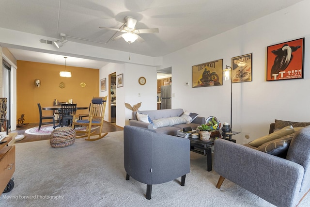1502 Woodbridge Rd Unit 2H, Joliet, IL 60436 - living area featuring a ceiling fan and carpet floors