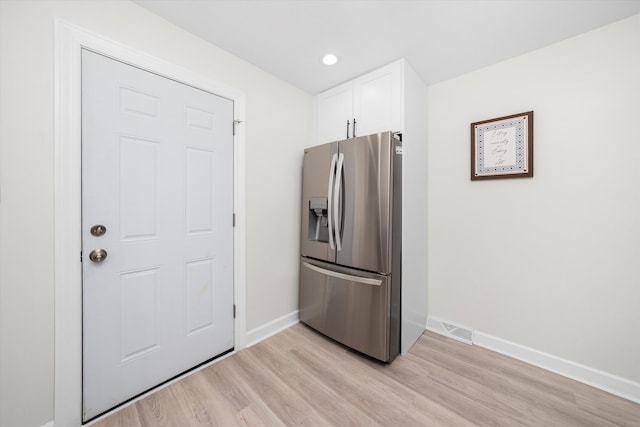 10846 S Sacramento Ave, Chicago, IL 60655 - kitchen with stainless steel fridge with ice dispenser, white cabinets, light wood-type flooring, and recessed lighting