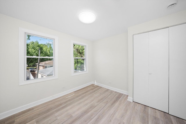10846 S Sacramento Ave, Chicago, IL 60655 - unfurnished bedroom featuring light wood-type flooring and a closet