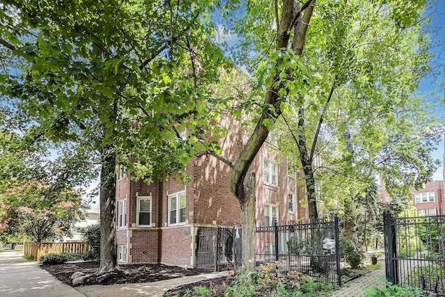 3851 N Kedvale Ave Unit E3, Chicago, IL 60641 - view of side of home with brick siding