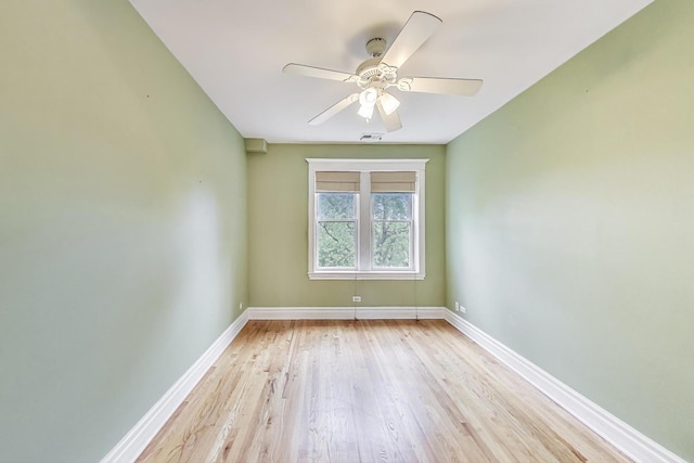 3851 N Kedvale Ave Unit E3, Chicago, IL 60641 - spare room featuring light wood-style floors and a ceiling fan