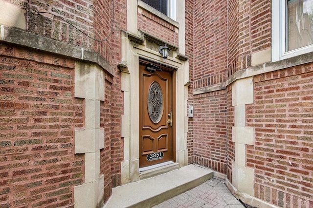3851 N Kedvale Ave Unit E3, Chicago, IL 60641 - view of exterior entry with brick siding