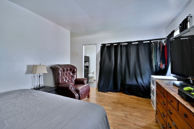 518 Emerson Cir, Bolingbrook, IL 60440 - bedroom featuring light wood finished floors and ensuite bath