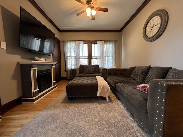 6326 W Berenice Ave, Chicago, IL 60634 - living area featuring ceiling fan, crown molding, light wood-style flooring, and a fireplace