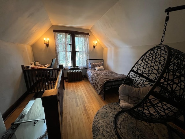 6326 W Berenice Ave, Chicago, IL 60634 - bedroom featuring radiator, wood finished floors, and vaulted ceiling