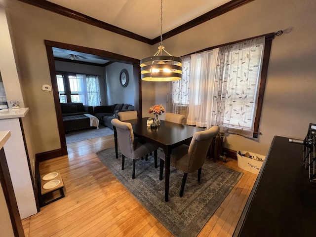 6326 W Berenice Ave, Chicago, IL 60634 - dining space featuring crown molding and light wood finished floors