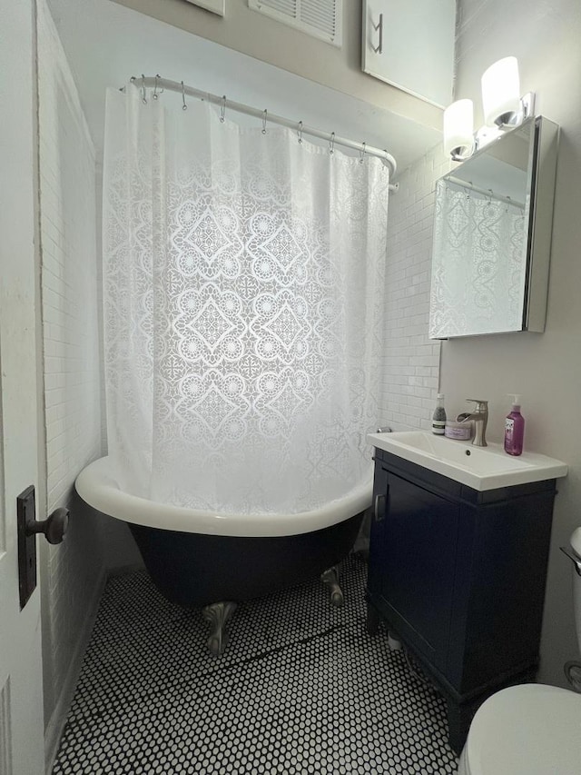 6326 W Berenice Ave, Chicago, IL 60634 - bathroom with vanity, tile patterned flooring, and shower / bath combo