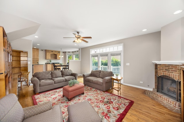 401 Greenwood Rd, Glenview, IL 60025 - living room with a fireplace, light wood-type flooring, ceiling fan, and recessed lighting