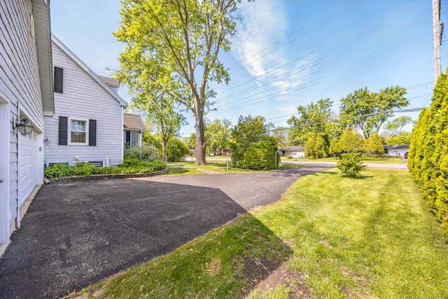 401 Greenwood Rd, Glenview, IL 60025 - view of grassy yard featuring driveway