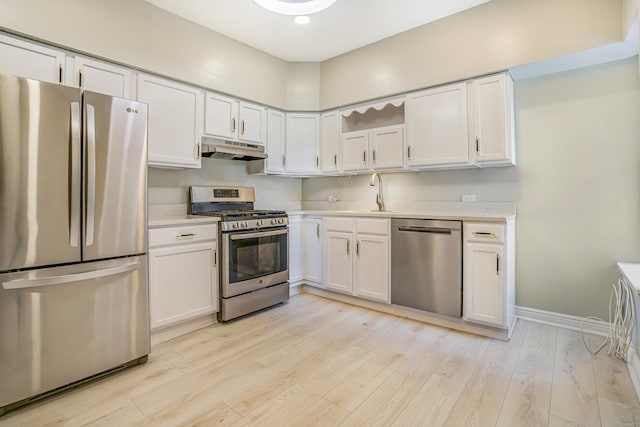 4640 N Kenmore Ave Unit 2S, Chicago, IL 60640 - kitchen with appliances with stainless steel finishes, under cabinet range hood, light countertops, white cabinets, and recessed lighting