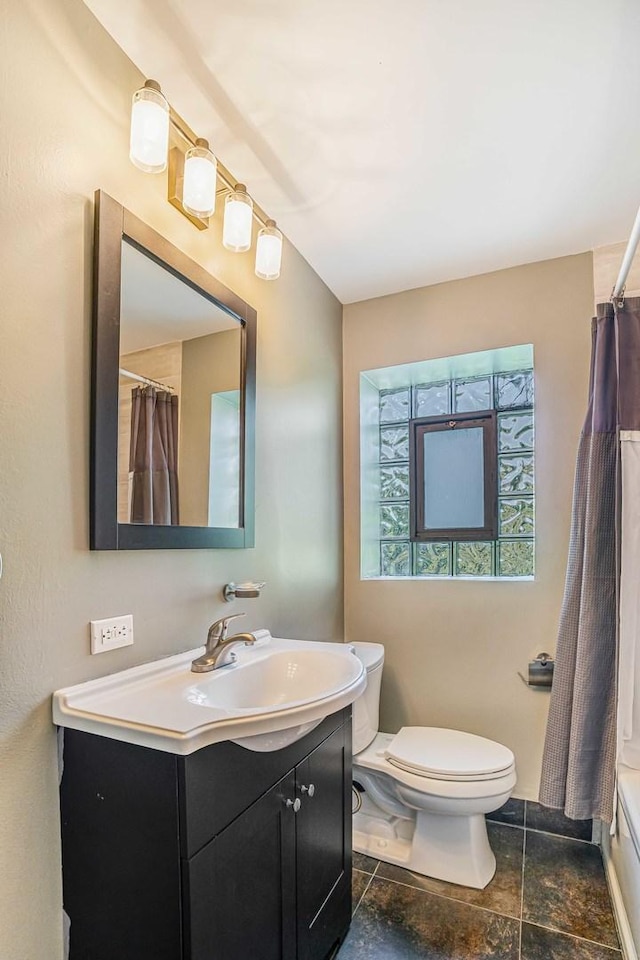 4640 N Kenmore Ave Unit 2S, Chicago, IL 60640 - bathroom with vanity, curtained shower, and stone finish flooring