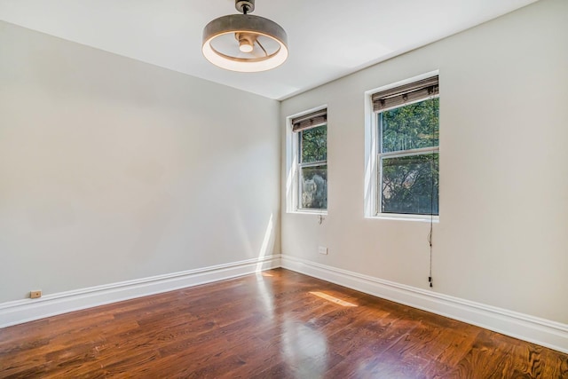 4640 N Kenmore Ave Unit 2S, Chicago, IL 60640 - spare room featuring dark wood-type flooring and baseboards