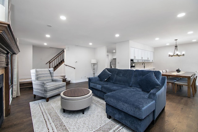 12256 S Arbor Trl Unit 11W, Palos Heights, IL 60463 - living room featuring wood finished floors, recessed lighting, a chandelier, stairway, and a fireplace