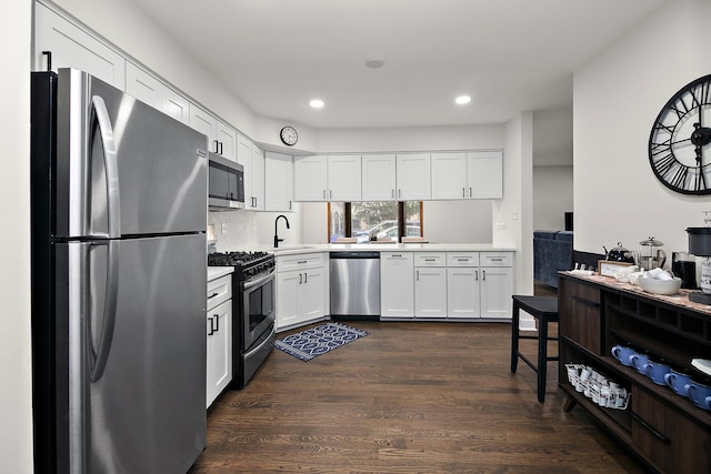 12256 S Arbor Trl Unit 11W, Palos Heights, IL 60463 - kitchen with stainless steel appliances, light countertops, white cabinets, dark wood-style flooring, and recessed lighting