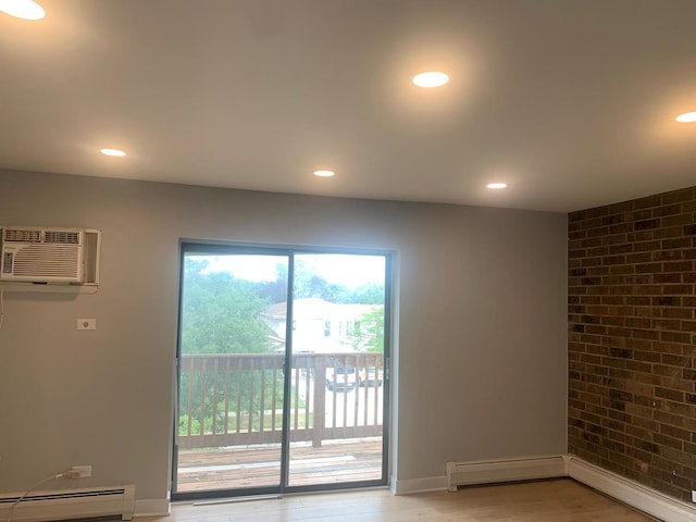 146 S Lalonde Ave Unit 3B, Addison, IL 60101 - unfurnished room featuring baseboard heating, a wall mounted AC, recessed lighting, light wood-style flooring, and a baseboard radiator