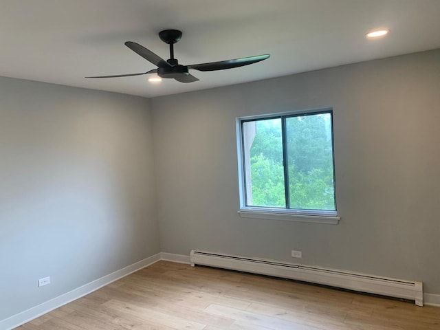 146 S Lalonde Ave Unit 3B, Addison, IL 60101 - spare room featuring a baseboard heating unit, a ceiling fan, recessed lighting, and light wood-style flooring