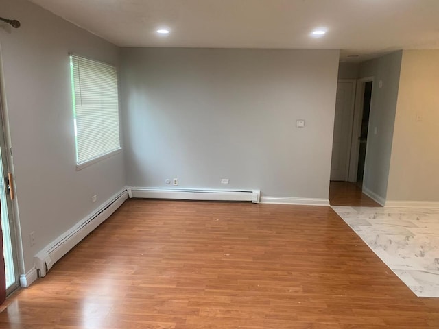 247 N Neltnor Blvd Unit E-1A, West Chicago, IL 60185 - spare room featuring a baseboard radiator, light wood-type flooring, and recessed lighting