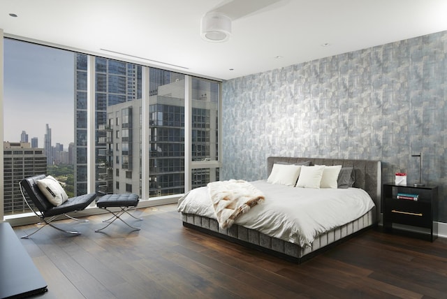 363 E Wacker Dr Unit 3303, Chicago, IL 60601 - bedroom featuring wood finished floors, wallpapered walls, a city view, and floor to ceiling windows
