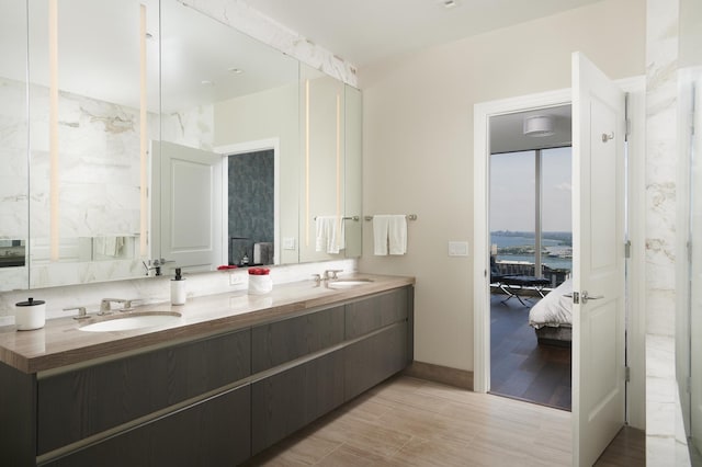 363 E Wacker Dr Unit 3303, Chicago, IL 60601 - ensuite bathroom featuring double vanity and baseboards