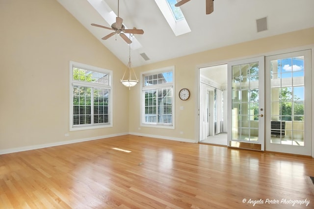 32756 N Stone Manor Dr, Grayslake, IL 60030 - unfurnished room with high vaulted ceiling, ceiling fan, a skylight, and light wood finished floors