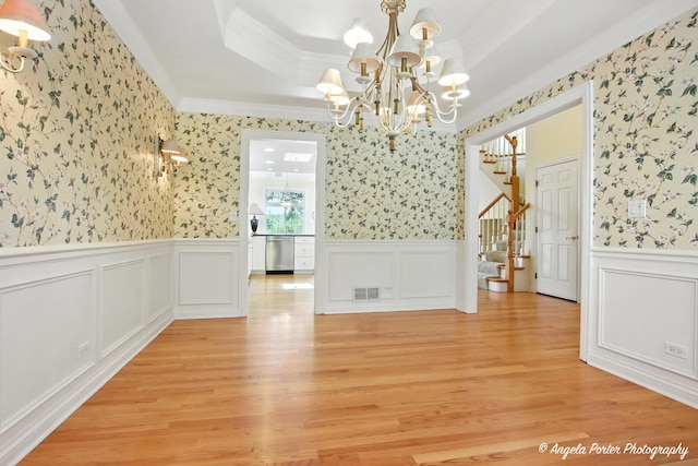 32756 N Stone Manor Dr, Grayslake, IL 60030 - unfurnished dining area with wallpapered walls, a chandelier, ornamental molding, a tray ceiling, and stairs
